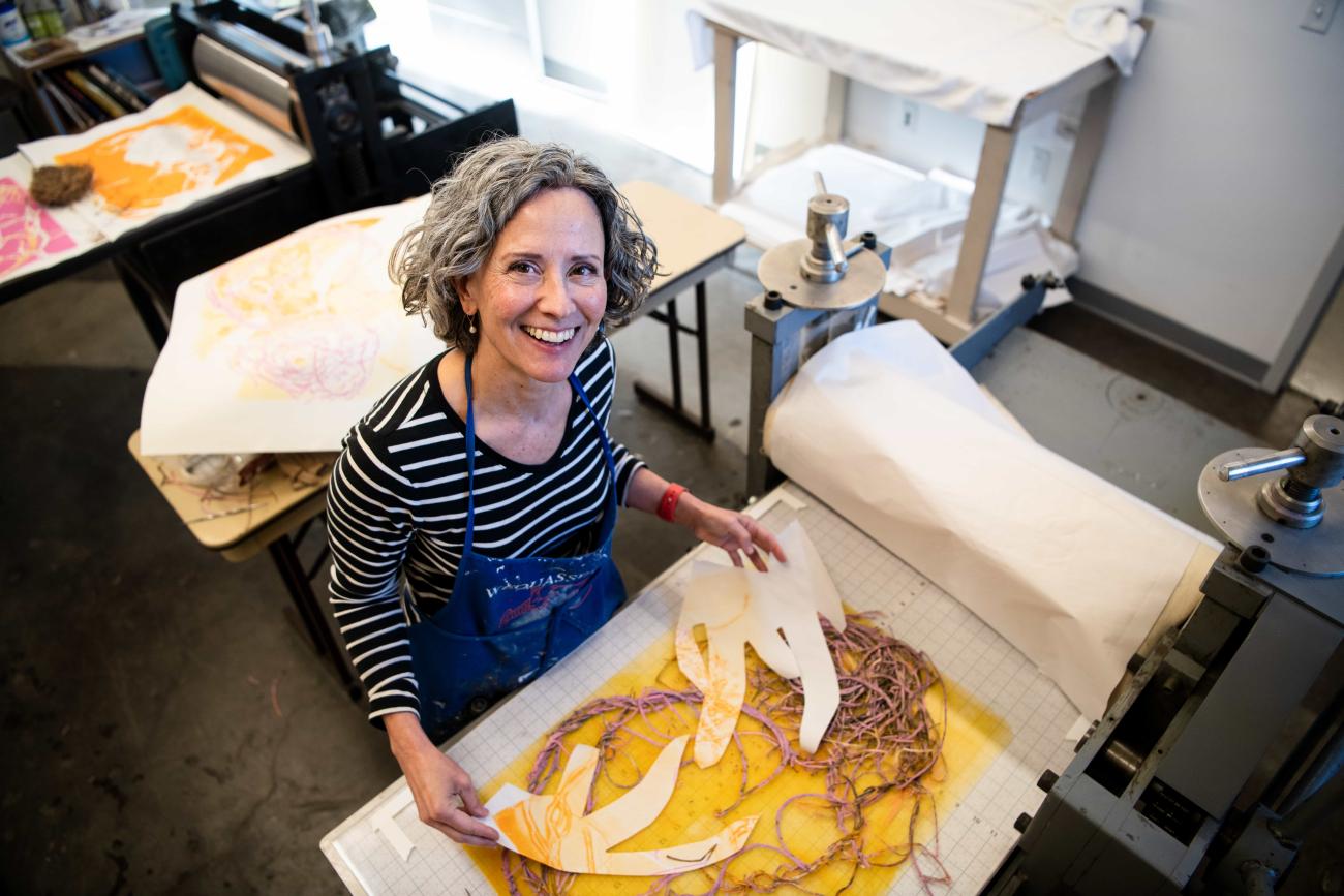 Deirdre Murphy with a print piece in her studio.